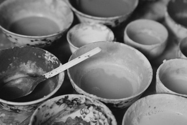 Bowls of colorful ceramic glazes